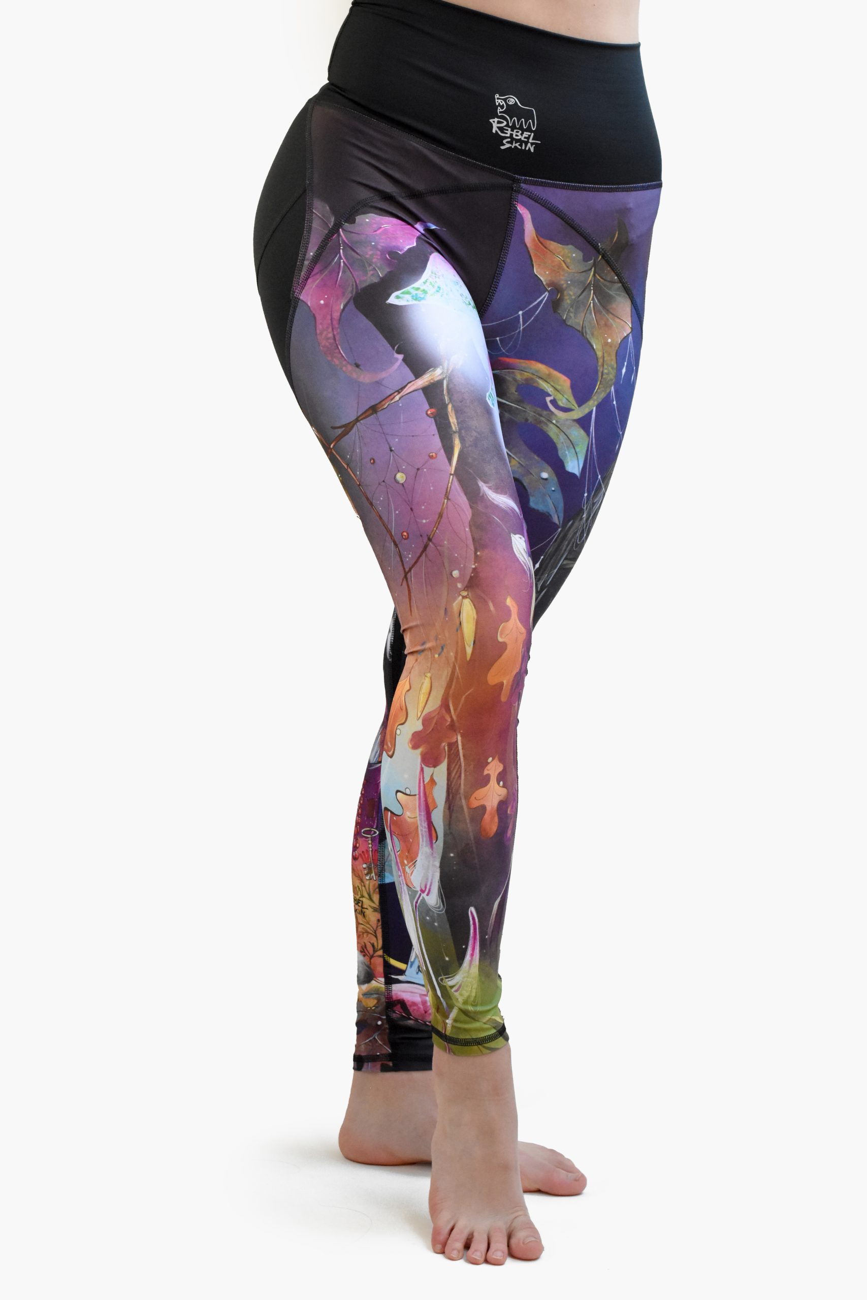 High-waisted leggings with graphics from tattoo artist Dancink Needles. Purple high-waisted leggings